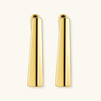 Sleek 14K gold-plated sterling silver huggie earrings with polished finish and geometric elongated design on white background.