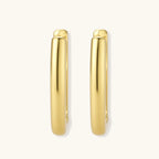 Polished gold-plated sterling silver hoop earrings with hinged closure mechanism on white background.