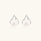 Silver mountain outline studs with baroque pearl and diamond accent on white background