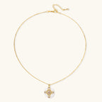 Gold-plated necklace with circular white enamel pendant featuring central zirconia stone and ornate decorative details