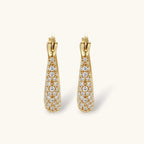 Gold-plated hoop earrings fully covered in sparkling zircon crystals with hinged closure on neutral background