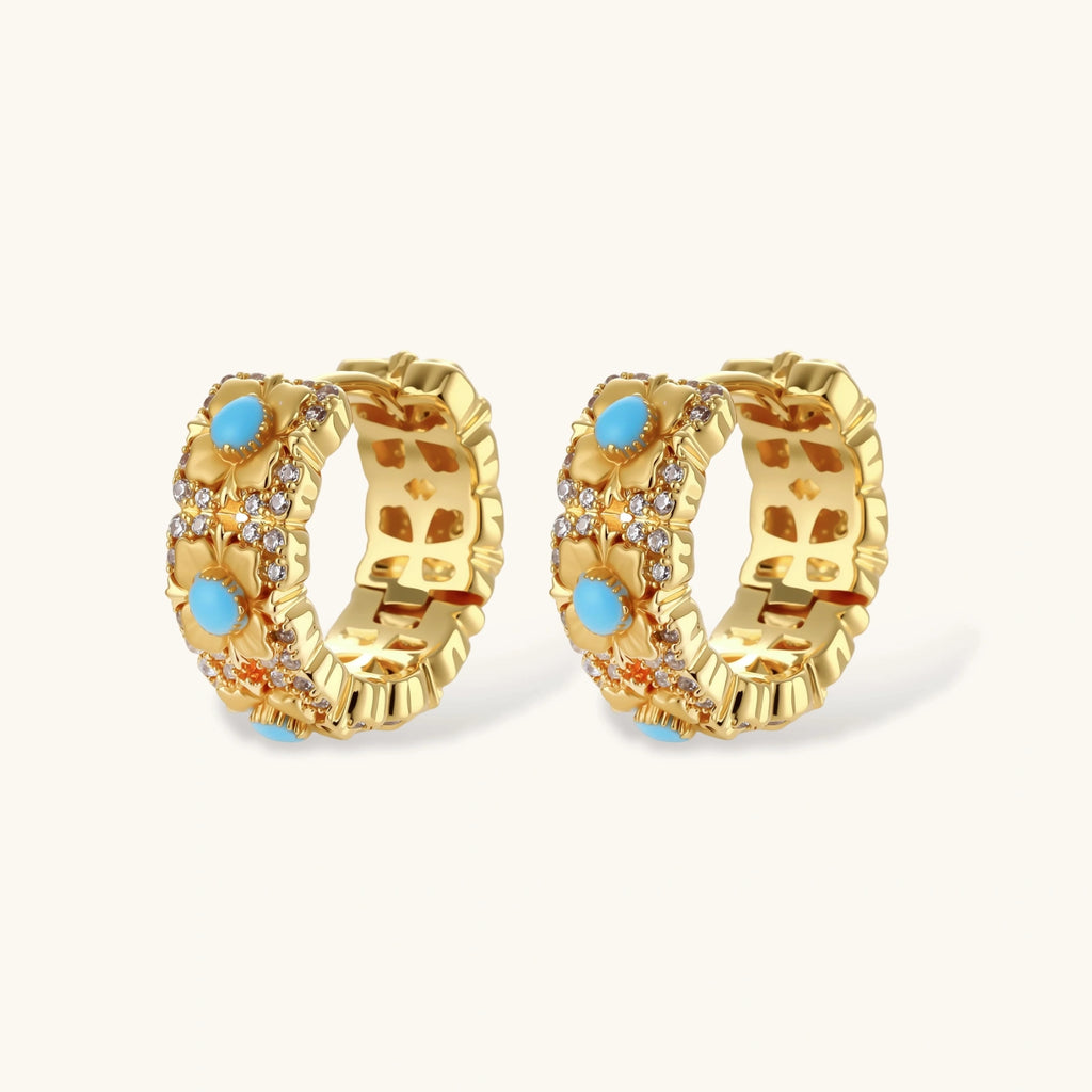 18K gold-plated hoop earrings with turquoise-centered flowers and crystal details on white background.