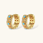 18K gold-plated hoop earrings with turquoise-centered flowers and crystal details on white background.