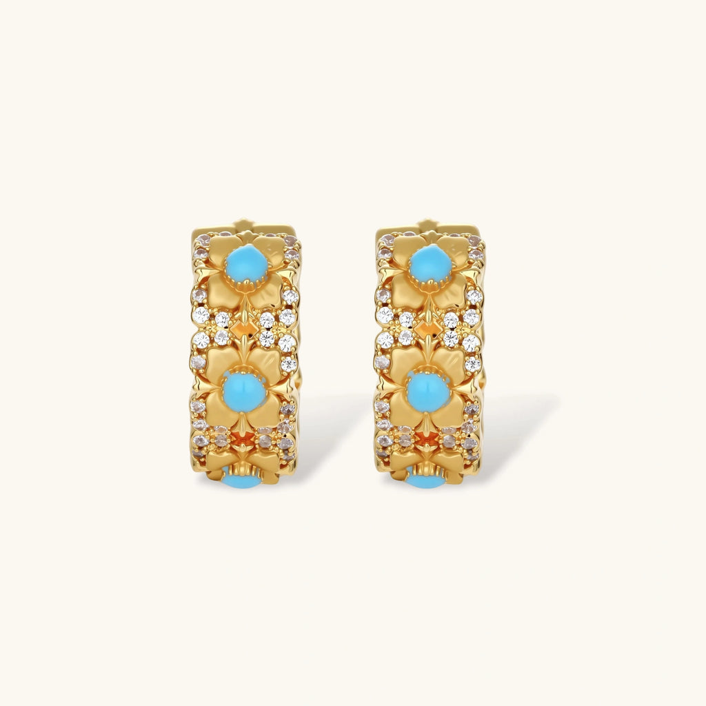 18K gold-plated hoop earrings with turquoise-centered flowers and crystal details on white background.
