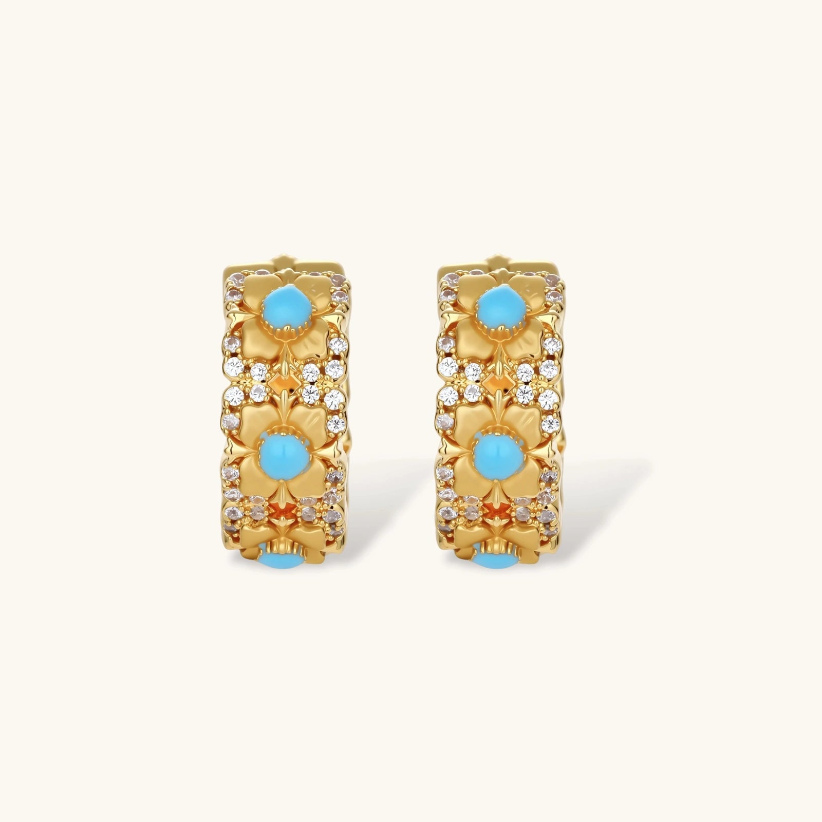 18K gold-plated hoop earrings with turquoise-centered flowers and crystal details on white background.