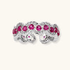 Ornate adjustable ring with pink cubic zirconia stones in white gold-plated copper setting with floral metalwork details