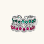 Platinum-plated copper ring with green zirconia stones in decorative scalloped wave pattern, adjustable band design.