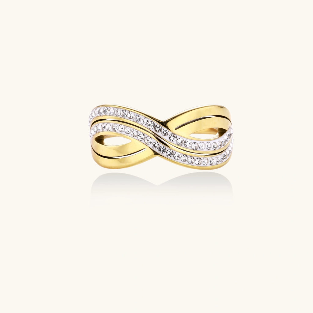 Gold-plated ring with interweaving wave bands and two rows of clear rhinestones creating an infinity pattern